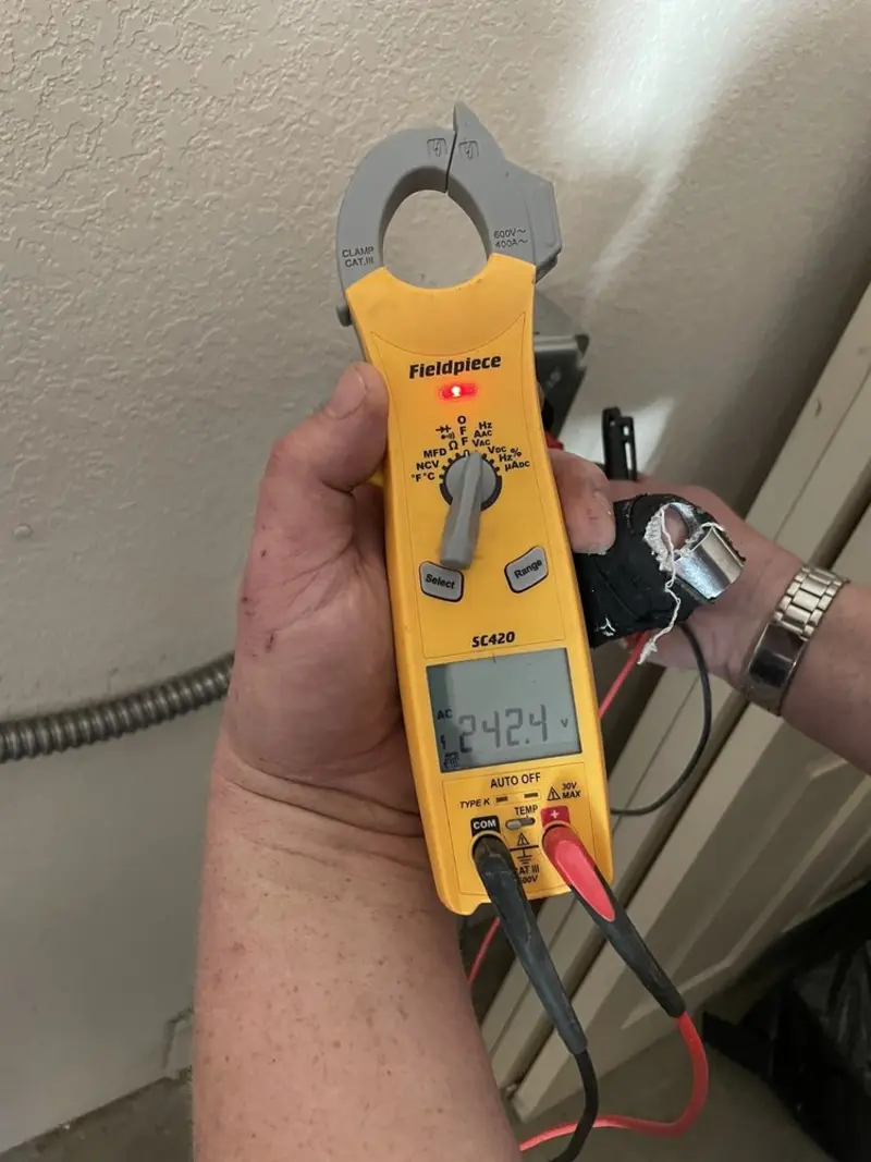 Voltage testing with clamp meter during Circuit Breaker Repair in Greensburg